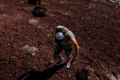 High angle view of man standing on rock