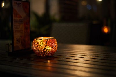Close-up of lantern on table