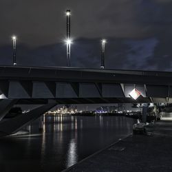 Illuminated baakenhafen bridge over elbe river at night