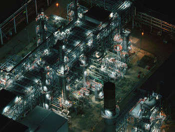 Nuclear power plant, high angle view of illuminated buildings in city at night