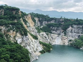 Scenic view of river amidst mountains