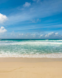 Empty tropical sandy beach with turquoise ocean