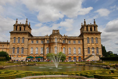 Stately home against cloudy sky