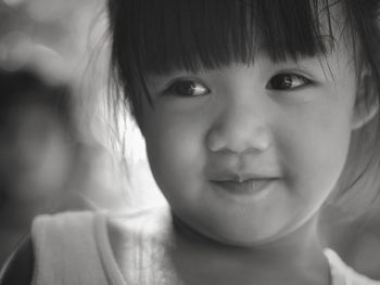 Close-up of cute girl looking away