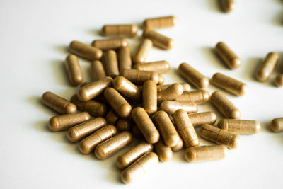 Close-up of pills on white background