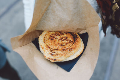 Close-up of number on bun in paper bag