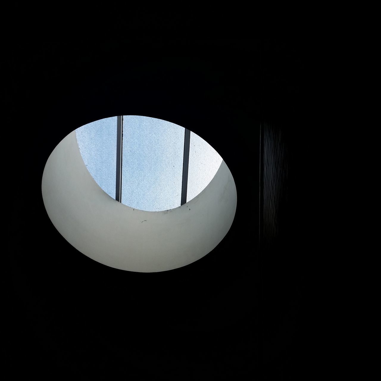 LOW ANGLE VIEW OF ILLUMINATED ELECTRIC LAMP IN DARKROOM