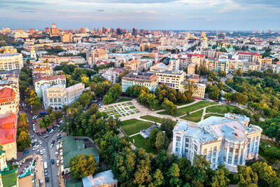 High angle view of buildings and trees against sky