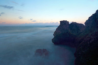 Scenic view of sea against sky at sunset