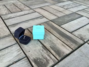 High angle view of arrow symbol on wooden table