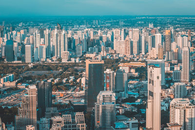 High angle view of modern buildings in city against sky