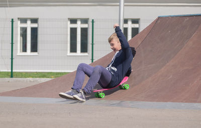 Teenage boy skateboarding on skateboard