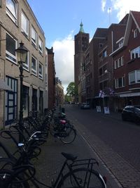 Bicycles against sky in city