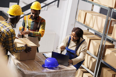 Side view of man working at construction site