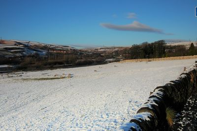 Scenic view of snowy landscape against clear sky