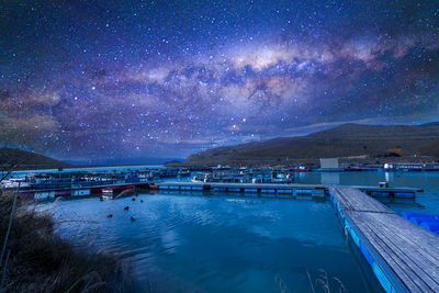 Scenic view of sea against sky at night