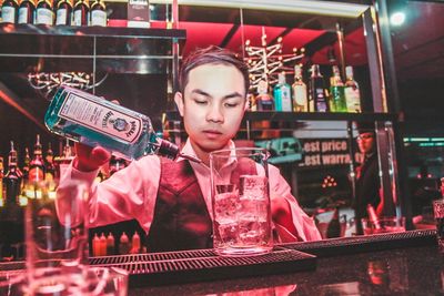 Low angle view of a boy drinking glass in a restaurant