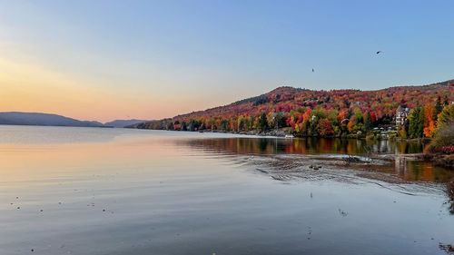 Scenic view of lake against sky during sunset