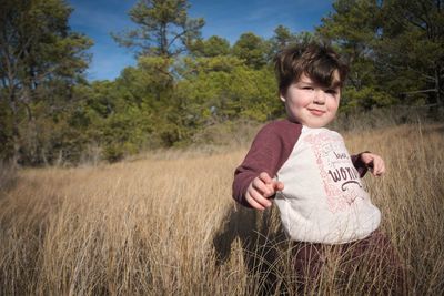 Portrait of a girl holding a field