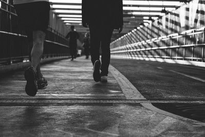 Low section of people on footbridge