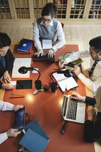 High angle view of lawyers working at table in board room