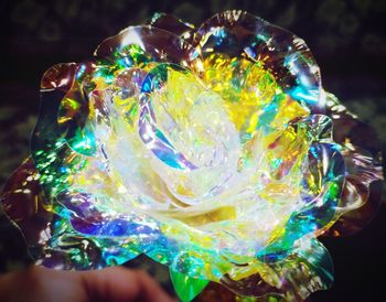 Close-up of hand holding multi colored light painting