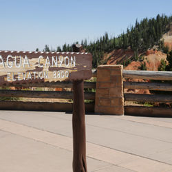 Text on wood against clear sky