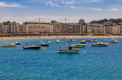 Boats in sea against sky