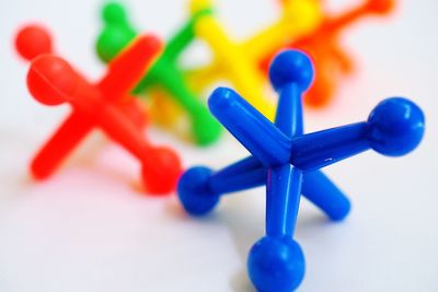 Close-up of colorful toys against blue background