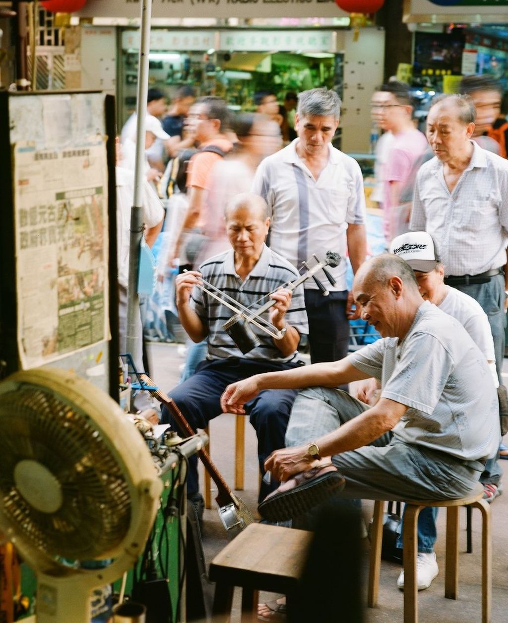 food and drink, men, lifestyles, sitting, casual clothing, leisure activity, indoors, table, food, chair, restaurant, person, small business, retail, boys, incidental people, standing