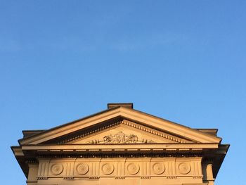 Low angle view of built structure against clear blue sky