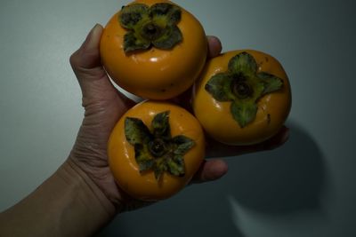 Close-up of hand holding fruit