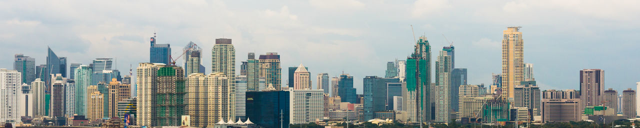 Modern cityscape against sky