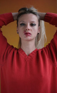 Close-up portrait of woman with smudged make-up