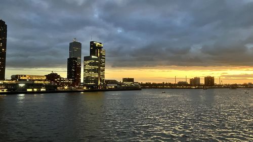 Illuminated city at waterfront