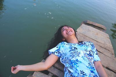 Portrait of young woman on pier