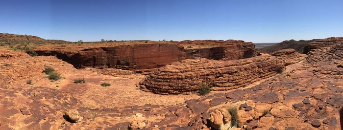 Scenic view of desert against blue sky