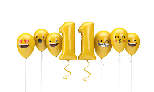 Close-up of yellow balloons against white background