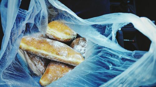 Close-up of loaves of bread in plastic bag