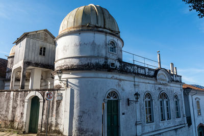 Low angle view of historic building against sky