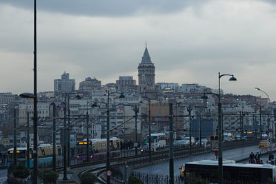 Street against galata tower amidst buildings in city