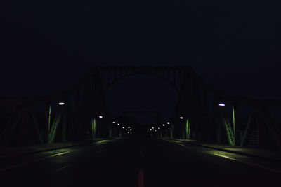 View of illuminated tunnel at night