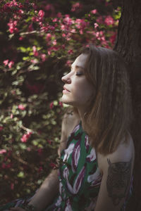 Close up woman resting with closed eyes in garden portrait picture