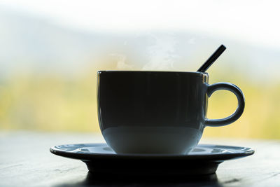 Close-up of coffee cup on table