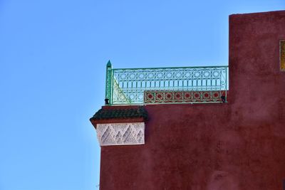 Low angle view of building against clear blue sky