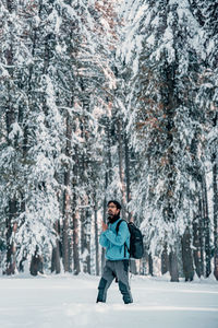 Portrait of boy standing on snow