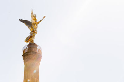 Low angle view of statue against sky