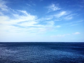 Scenic view of sea against blue sky