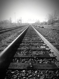 Surface level of railroad tracks against sky