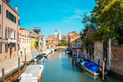 Boats on canal in city